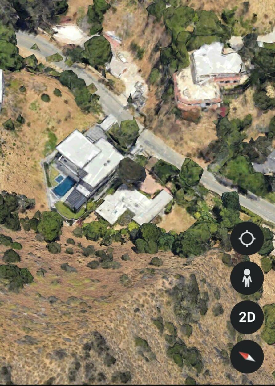 Aerial shot of the house from another angle.