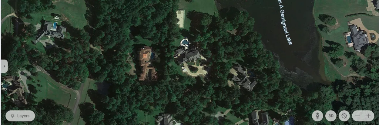A farther shot of the mansion, showing the lush green neighborhood (Image Credit: Google Earth)
