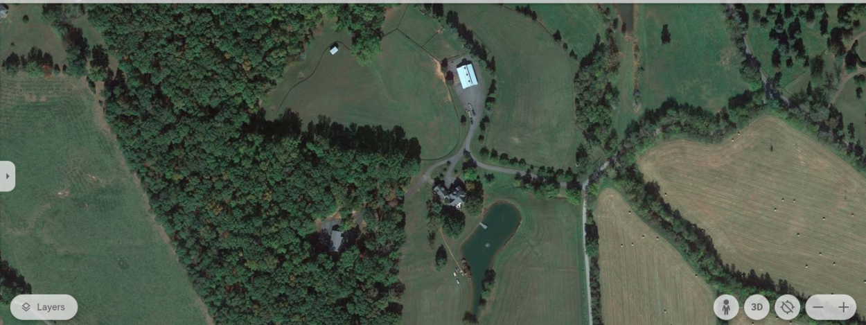 Farther shot of the house showing the neighborhood (Image Credit: google Earth)
