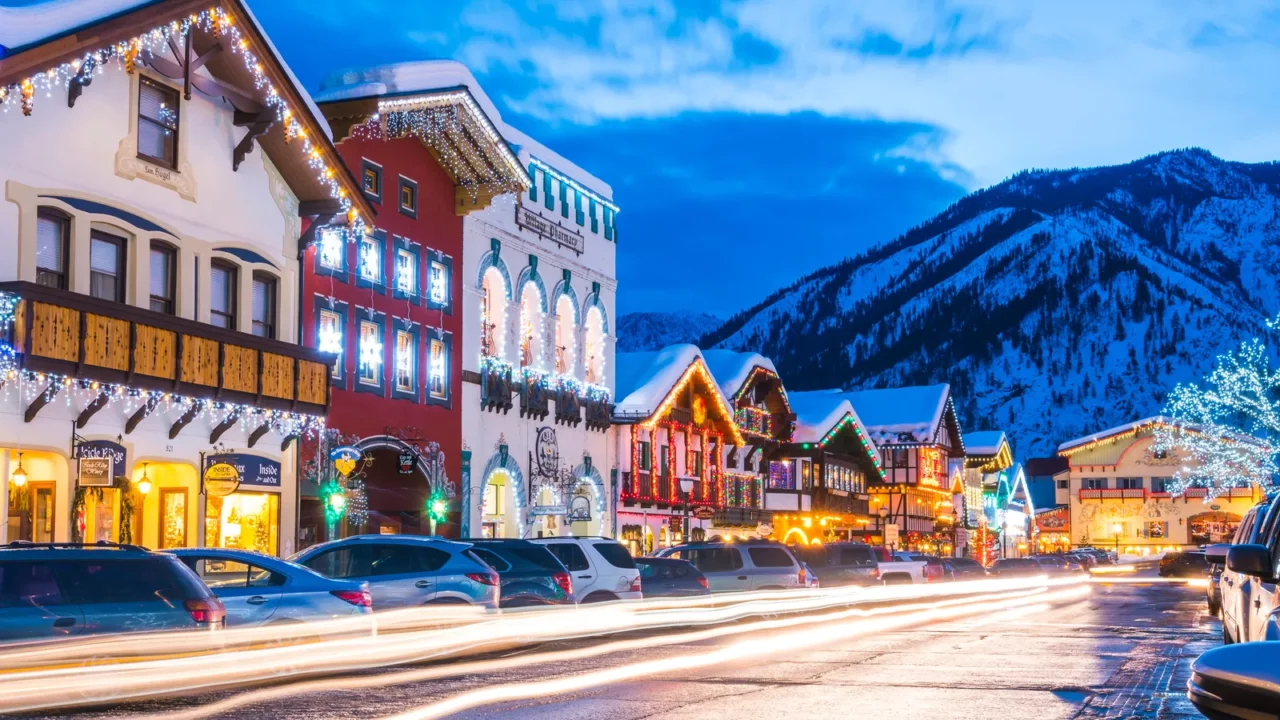 A festive evening scene in the Bavarian-style village of Leavenworth, Washington, during the winter season.